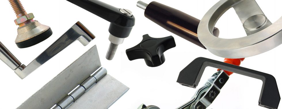 Closeup shot of a CNC machine processing a piece of metal. There are three water streams splashing the object to cool it down.